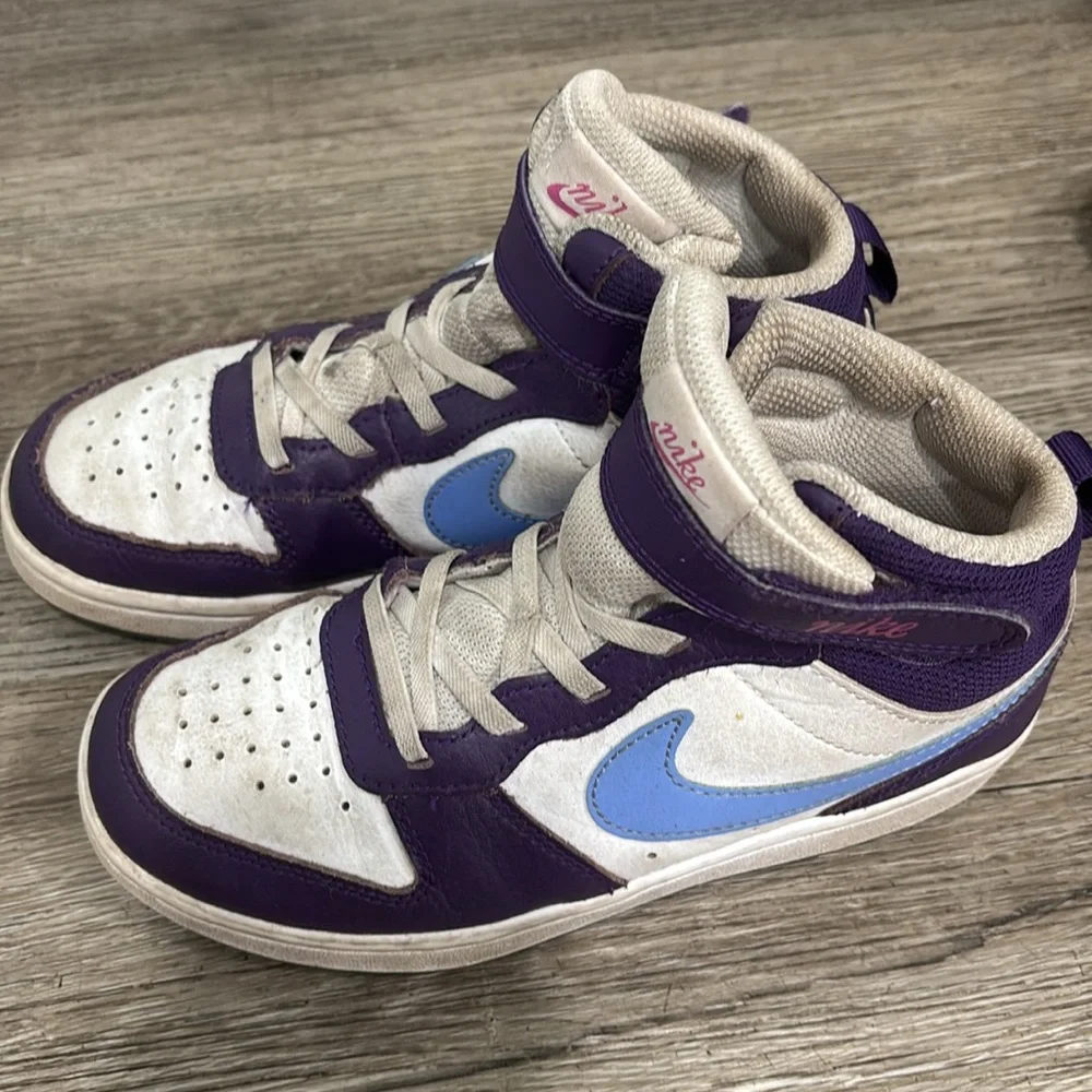 Nike girls high top sneakers. Used but still have life left to them! Size 1.5